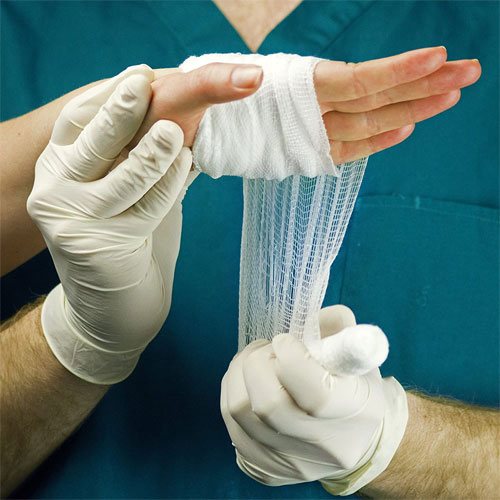 AMMEX Ivory Stretch Vinyl Exam Latex-Free Disposable Gloves - Box of 100 - Image three